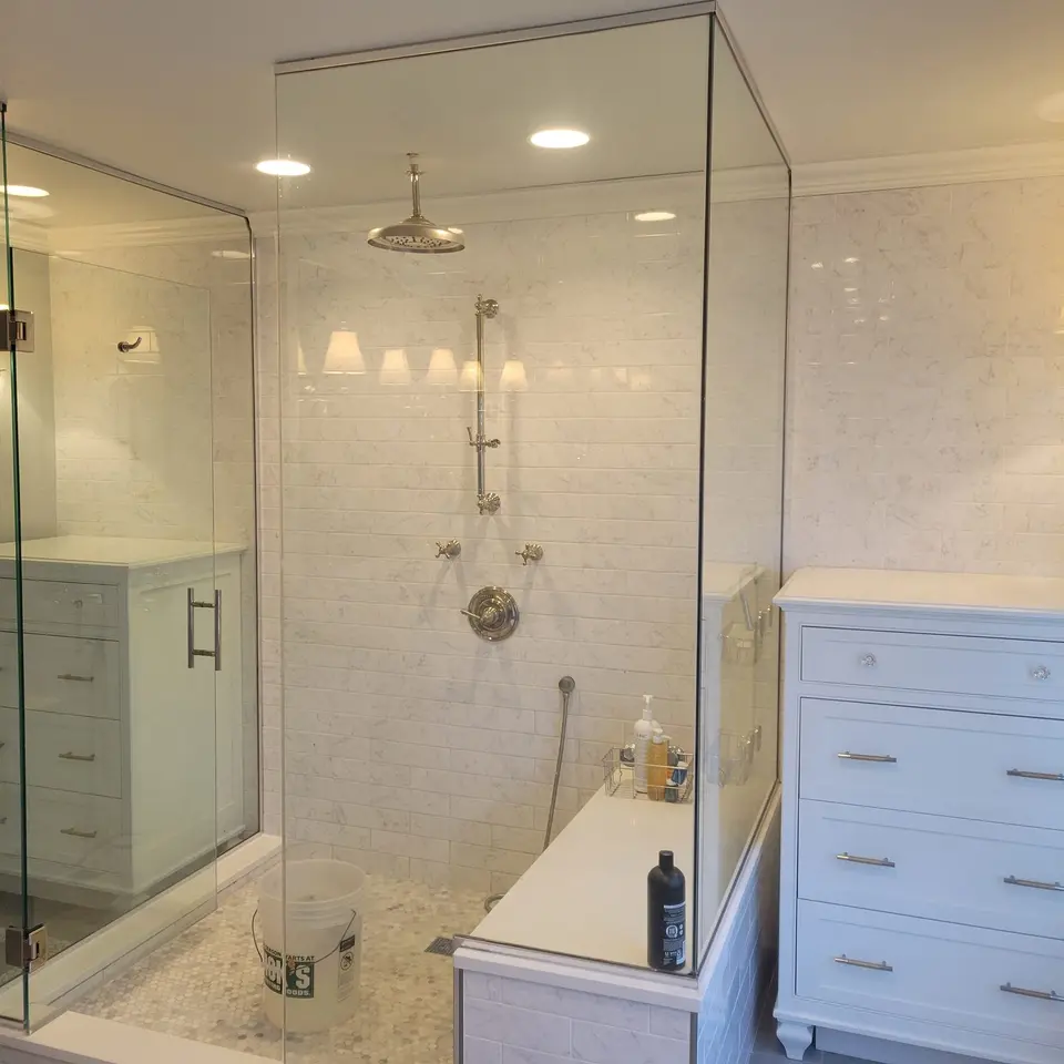 Custom marble walk-in shower by Keeler Carpentry