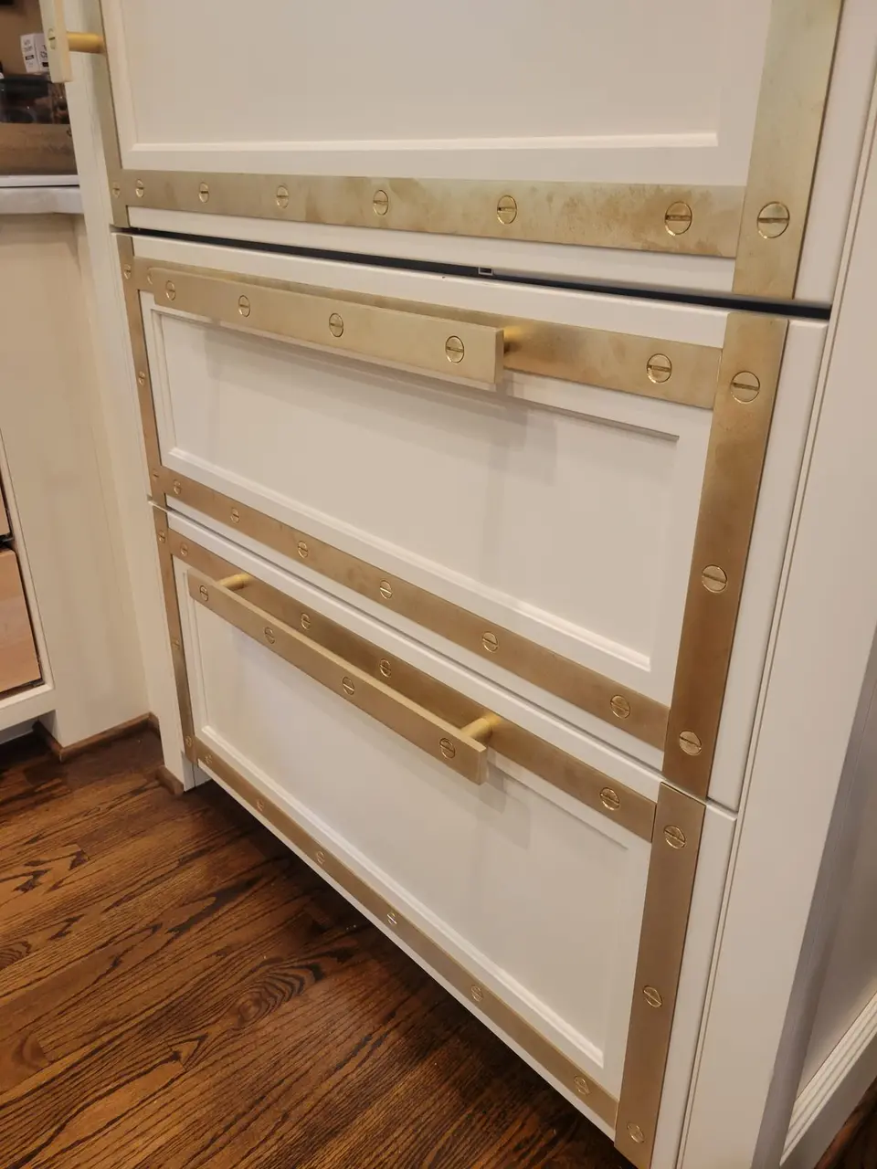 Brass-strapped custom cabinetry